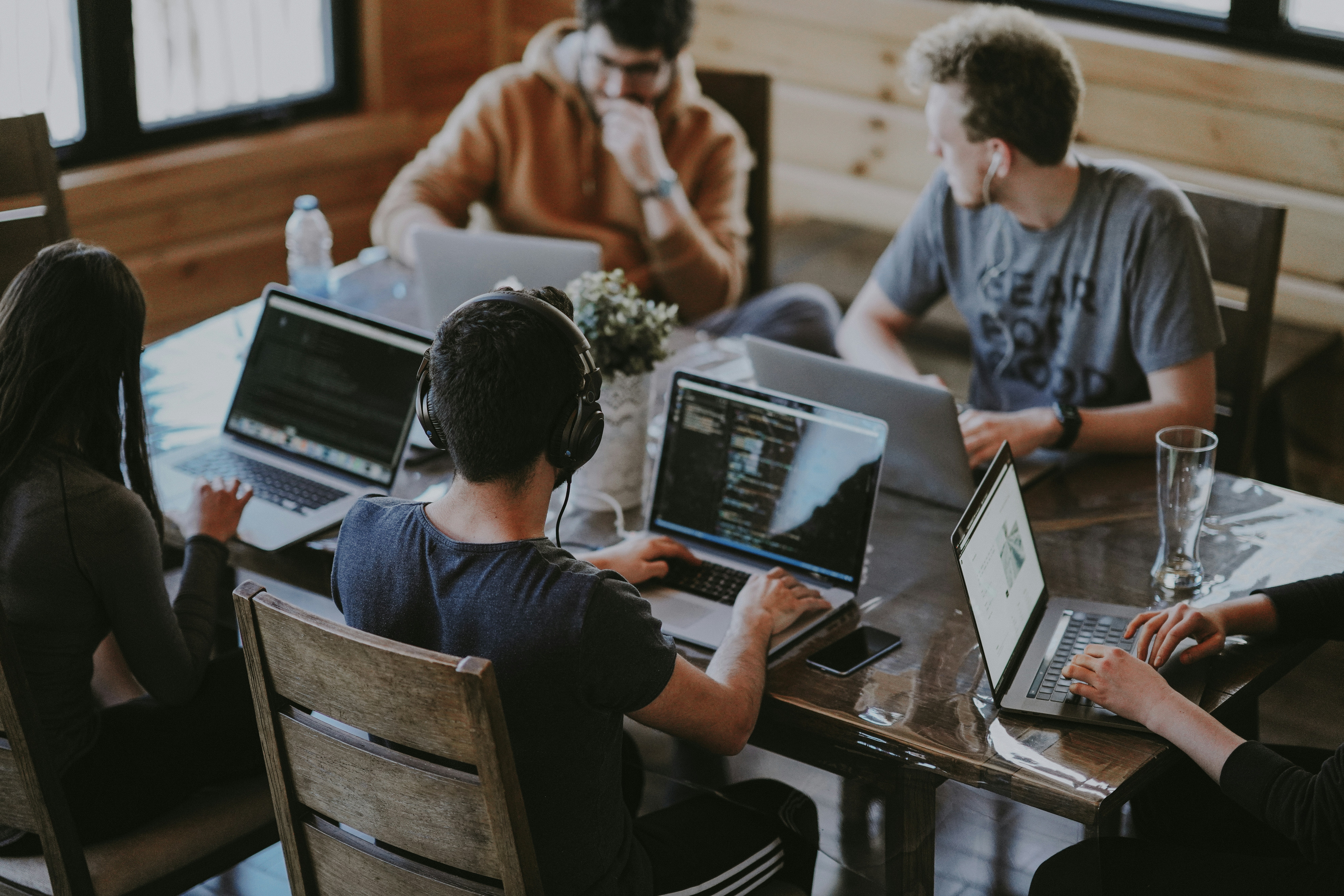 People researching property data on laptops — running the numbers before investing