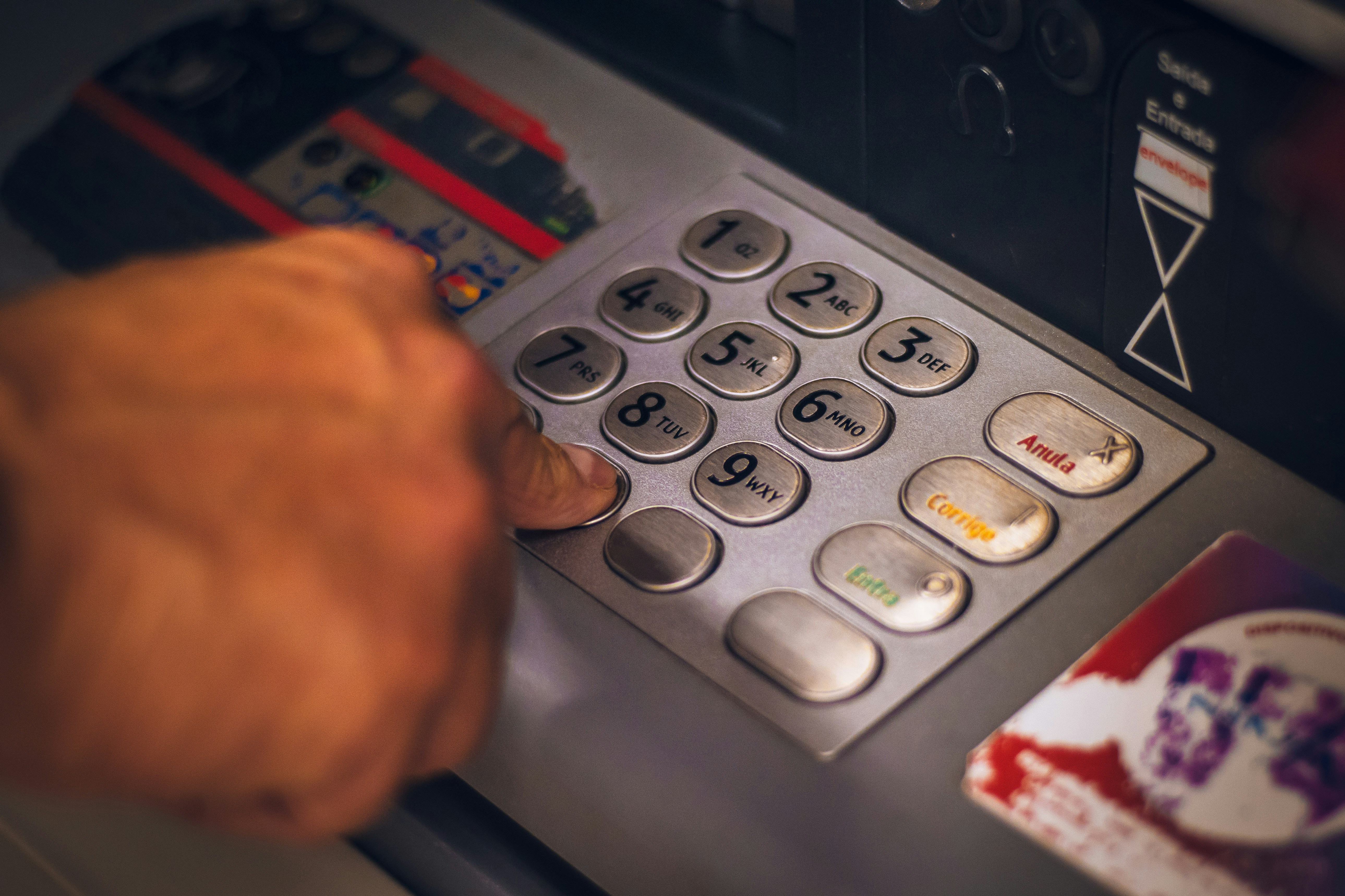 Entering a PIN at a bank terminal — applying to release your KiwiSaver for a deposit
